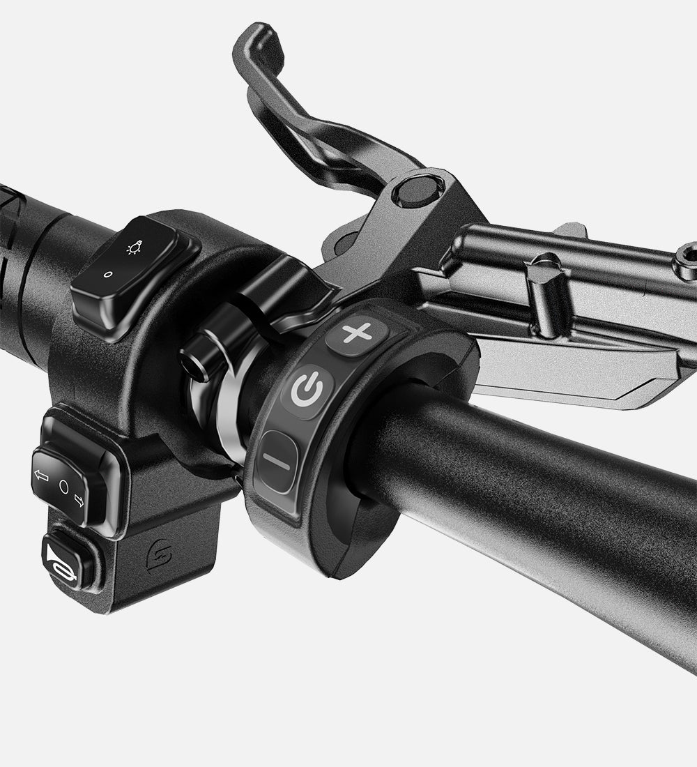 Integrated handlebar controls for headlight, horn, and turn signals on the MOVCAN EB60 moped style ebike.